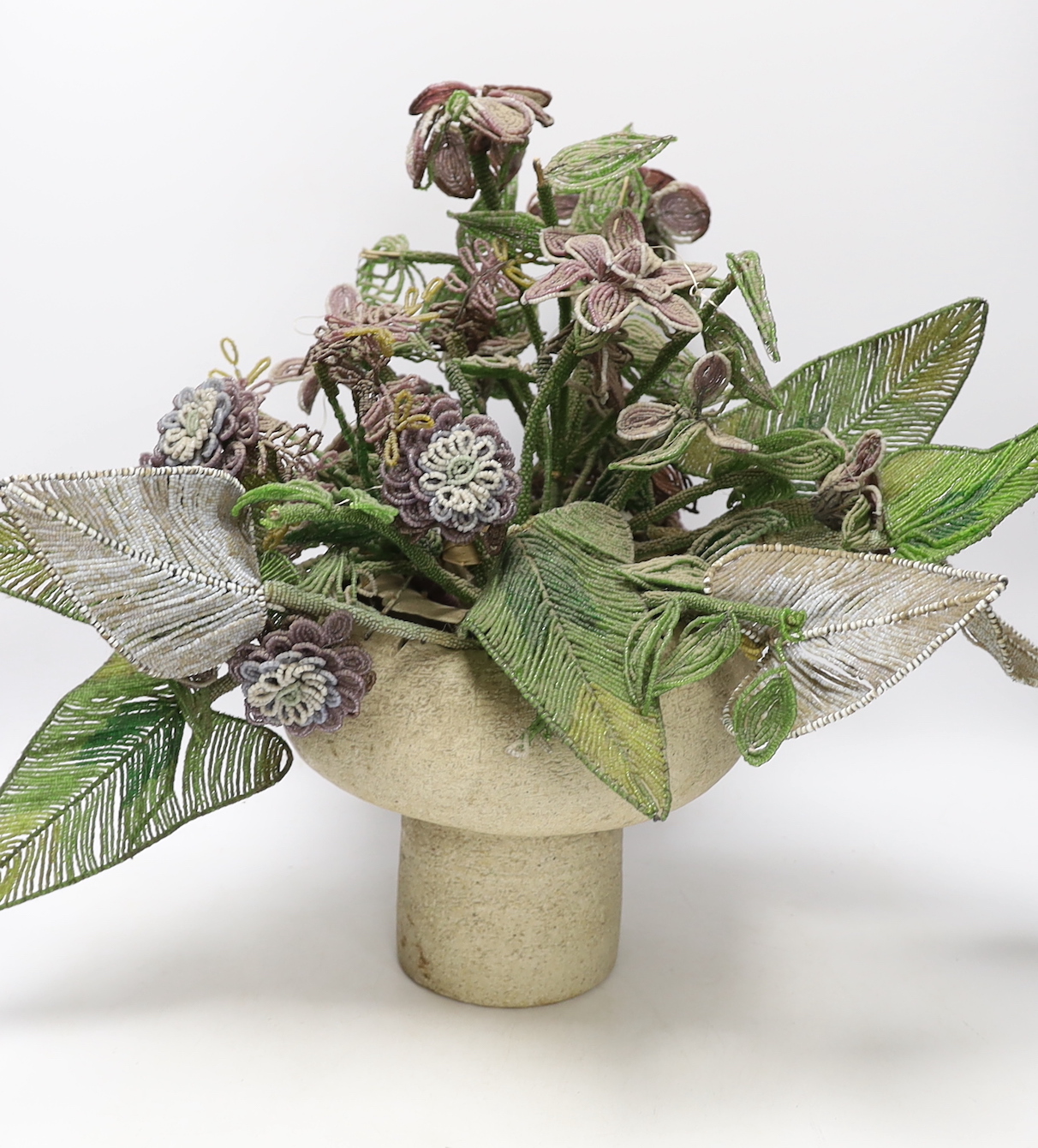 Possibly Mary Rogers (b.1929), a studio pottery vase with beadwork bouquet, vase 20cm high